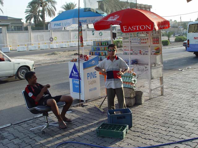 Two Guys At A Roadside Stand A