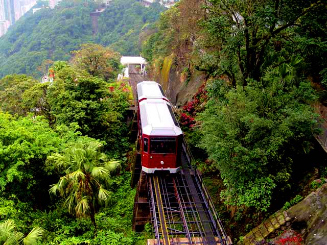 Peak Tram Coming Over The Hill