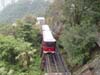 Peak Tram Coming Over The Hill