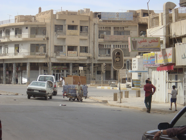 Baghdad Man With Belongings On A Cart