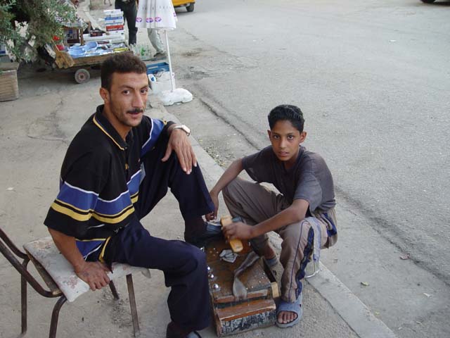 Shoe Shine Boy With Customer