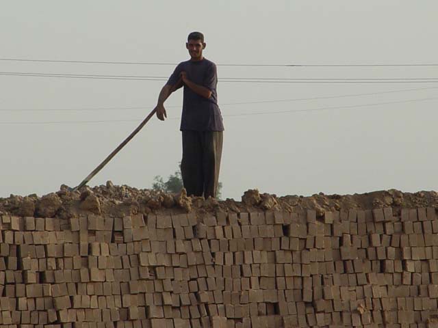 Man On A Pile Of Bricks