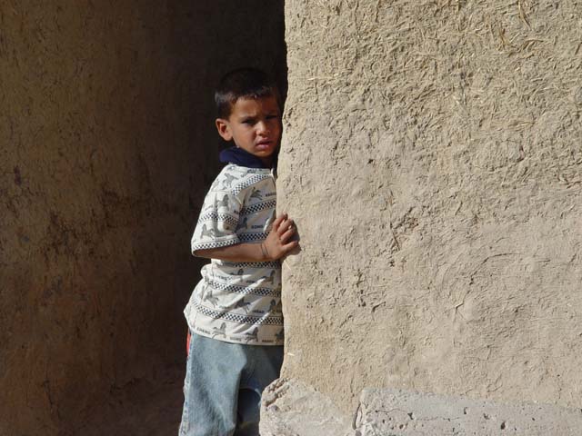 Little Kid Next To Wall