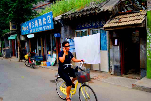 Woman On Bike And Cell